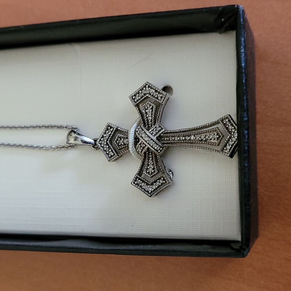Cross w rhinestones on silver coloured chain